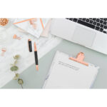 Office,Desk,Table,With,Laptop,,Clipboard,,Rose,Gold,Pen,,Clips